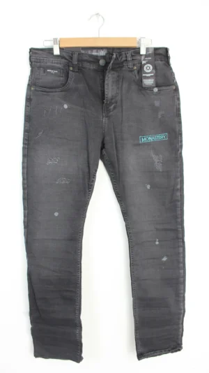 Jean Premium de alta calidad para hombre, corte moderno, color gris con bordado Monastery en pierna izquierda y nips