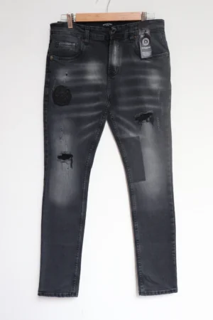Jean Premium de alta calidad para hombre, corte moderno, color gris humo oscuro con parche en pierna derecha, nips, destroyer, desgastes pines y botón contramarcado, bordado Monastery en parte trasera