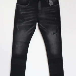 Jean Premium de alta calidad para hombre, corte moderno, color gris humo oscuro con parche en pierna derecha, nips, destroyer, desgastes pines y botón contramarcado, bordado Monastery en parte trasera